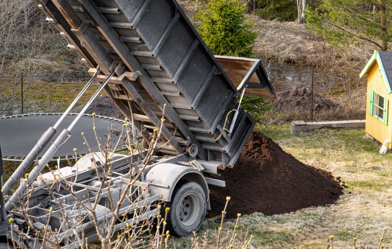 Large Dump Truck Delivering Soil